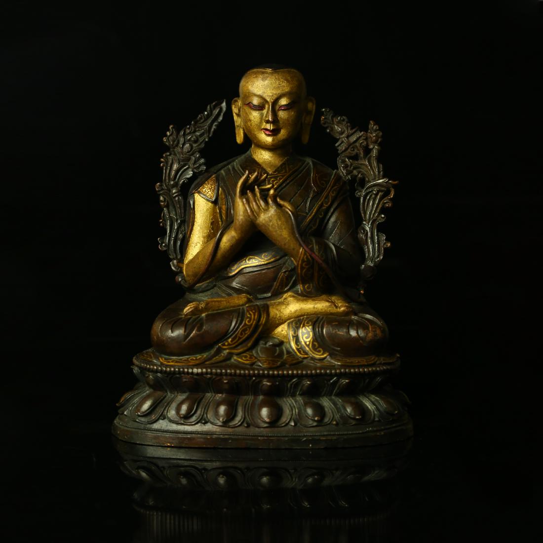 A CHINESE GILT BRONZE VAIROCANA BUDDHA: A CHINESE GILT BRONZE VAIROCANA BUDDHA;[H]6" [W] 4", 777g.