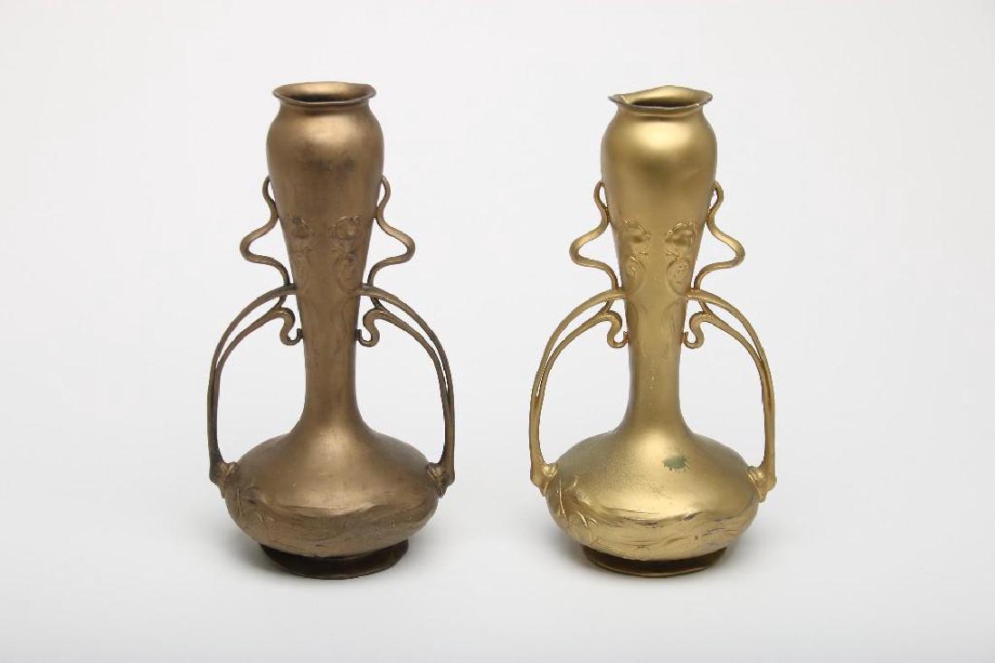 Pair Art Nouveau Vases as Lamp Bases Iris Floral Motif: Pair of Art Nouveau painted spelter vases converted to lamp bases. Each 11 1/4 inches tall, 6 inches across at widest point.
