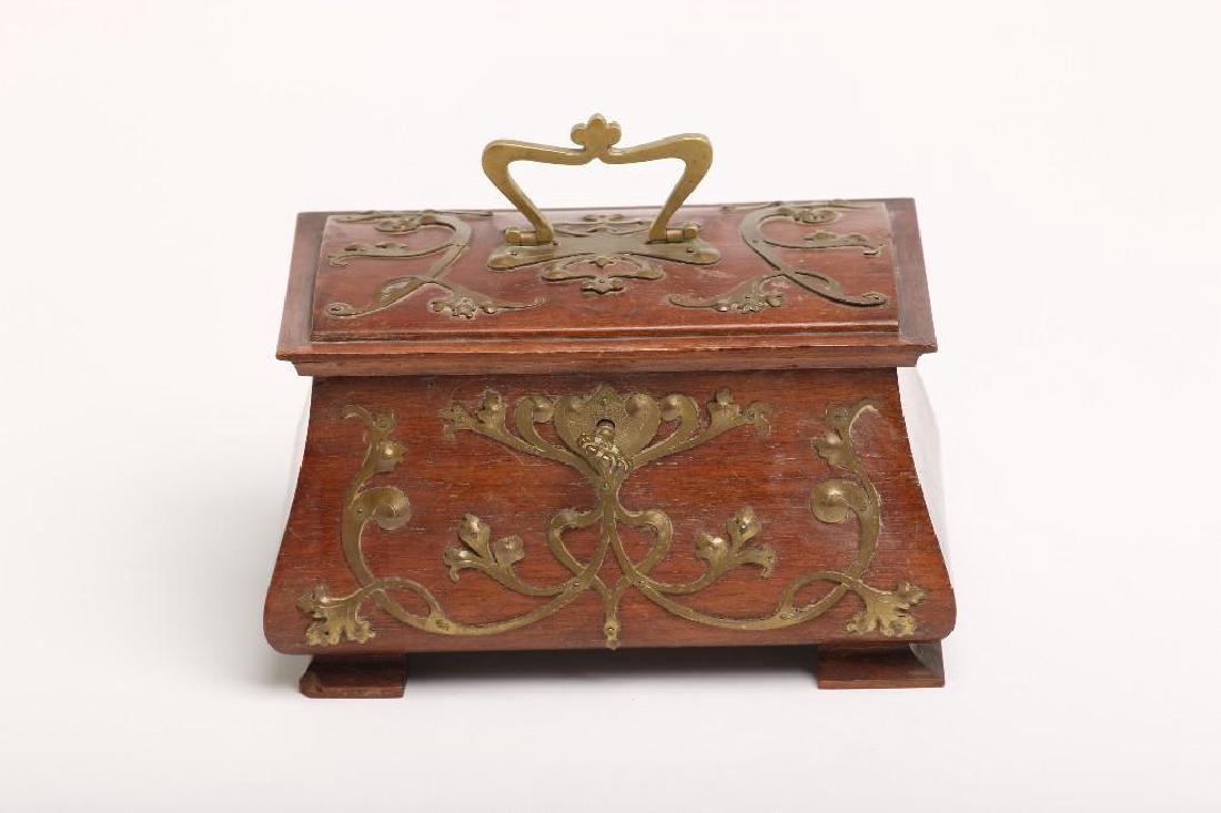 Art Nouveau Wooden Chest With Brass Metalwork Fitted: Small Art Nouveau wooden chest with velvet lined fitted interior with lift out divided tray. Exterior is covered with decorative metalwork, carrying handle and lock with key. Measures 6 3/4in x 4 1/2i
