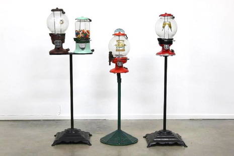 Mixed Lot of Four Mounted Gumball Machines on Stands: Mixed lot of four different gumball vending machines on stands. One machine with original stand, one with later stand, one unrelated stand holding two different machines. Size range 45" to 52" tall. P