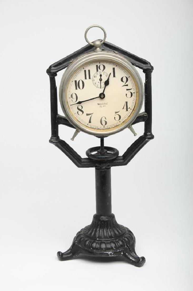 Vintage Westclox Big Ben Mantle Clock Cast Iron Stand: Vintage Westclox Big Ben peg leg mantle clock mounted onto a cast iron stand. Measures 14" high. Property from the estate of Walt Disney Imagineer John Patrick Burke.
