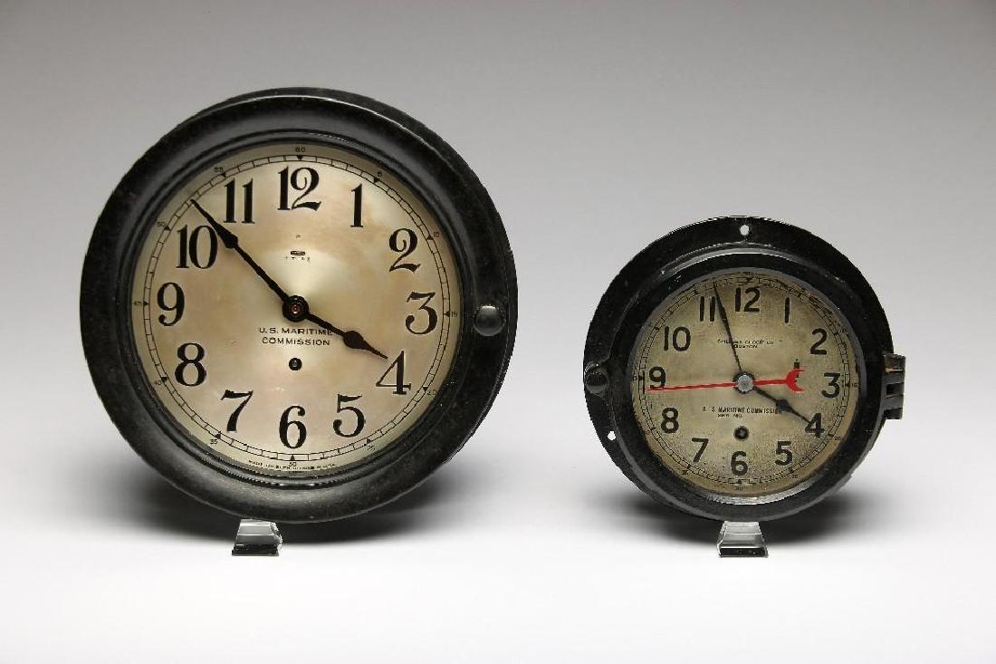 Two U.S. Maritime Commission Clocks Chelsea Seth Thomas: Two vintage Maritime Commission ships clocks with black case and light colored face by Chelsea and Seth Thomas. Measurements: 10 1/4in. diameter x 2 1/4in. H; 7 5/8in. diameter x 2 1/2in. H.