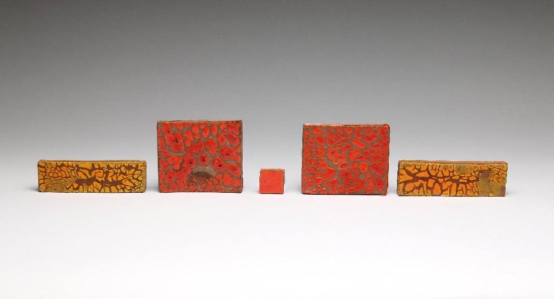 Doyle Lane MCM California Art Pottery Tile Orange: Doyle Lane Mid-Century California studio art tile group of five with textural glaze in shades of yellow and atomic orange. Unsigned. Two Yellow Bars 2in. x 6in. Two Atomic Orange Crackle Squares 4.375
