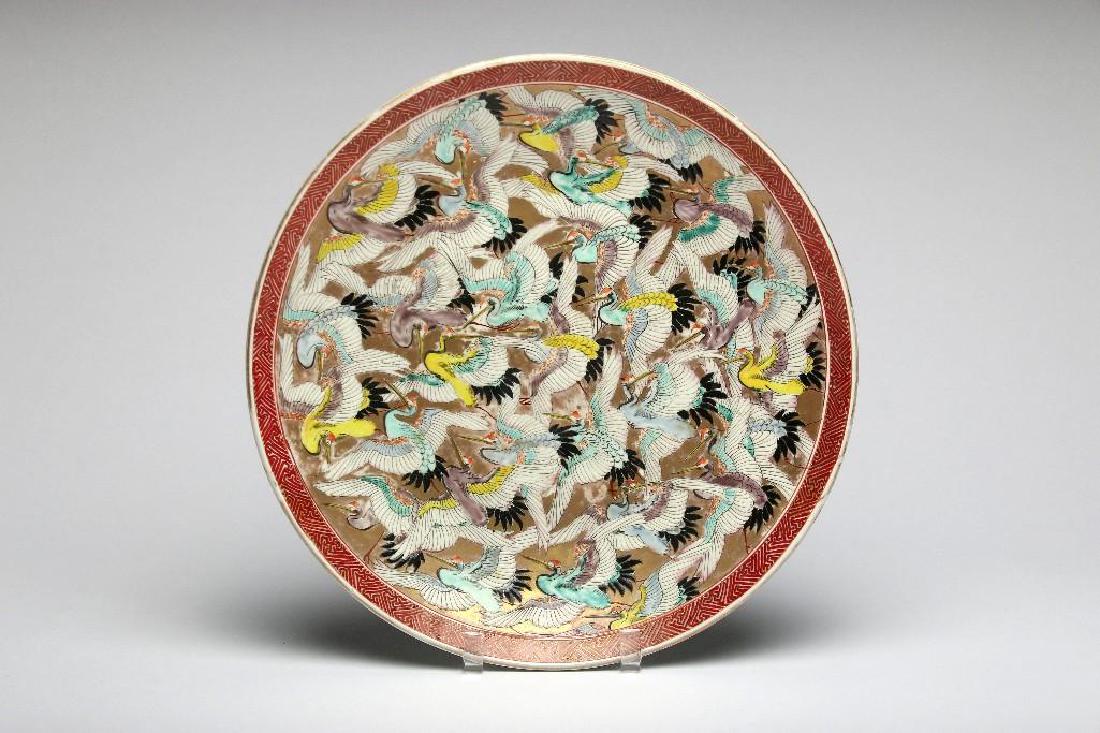 Japanese Thousand Crane Porcelain Charger: Vintage Japanese porcelain charger in a polychrome Thousand Cranes pattern over a gold colored ground. 2 in. H x 15.5 in. dia.