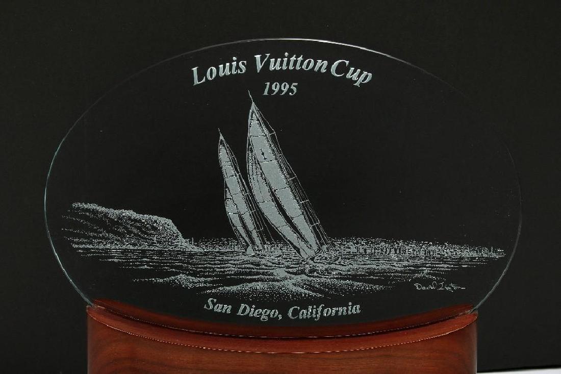 1995 Louis Vuitton Cup Yacht Race Commemorative Trophy: 1995 Louis Vuitton Cup, San Diego California. Commemorative display in wood and etched glass. 14 in. H x 14 in. W x 7 in. D.