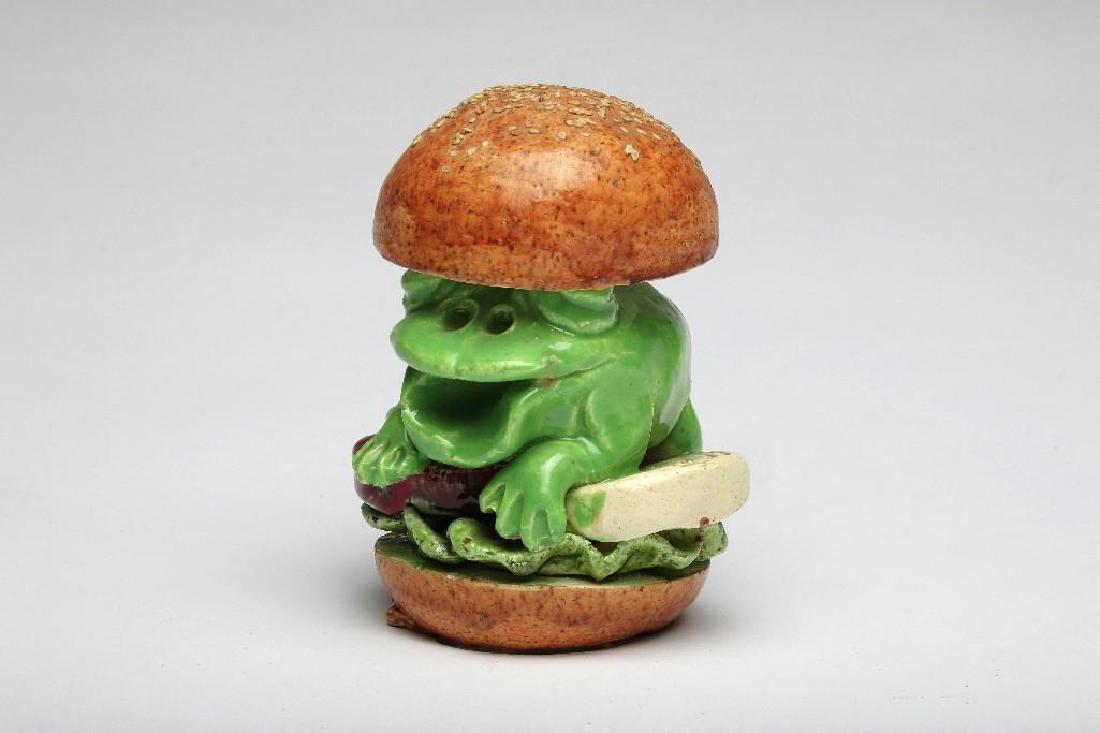 David James Gilhooly Frog Sculpture Hamburger: David James Gilhooly (1943-2013, Oregon / California) Frog as hamburger clay sculpture. 5.5 in. H x 4.5 in. W x 4 in. D.