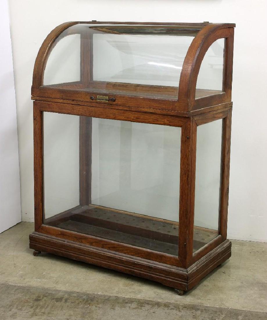 Vintage Oscar Onken Oak Cane Umbrella Retail Display: Vintage Oscar Onken and Co. oak cane or umbrella retail display fixture. 47.75 in H x 35.5 in. W x 18 in. D.