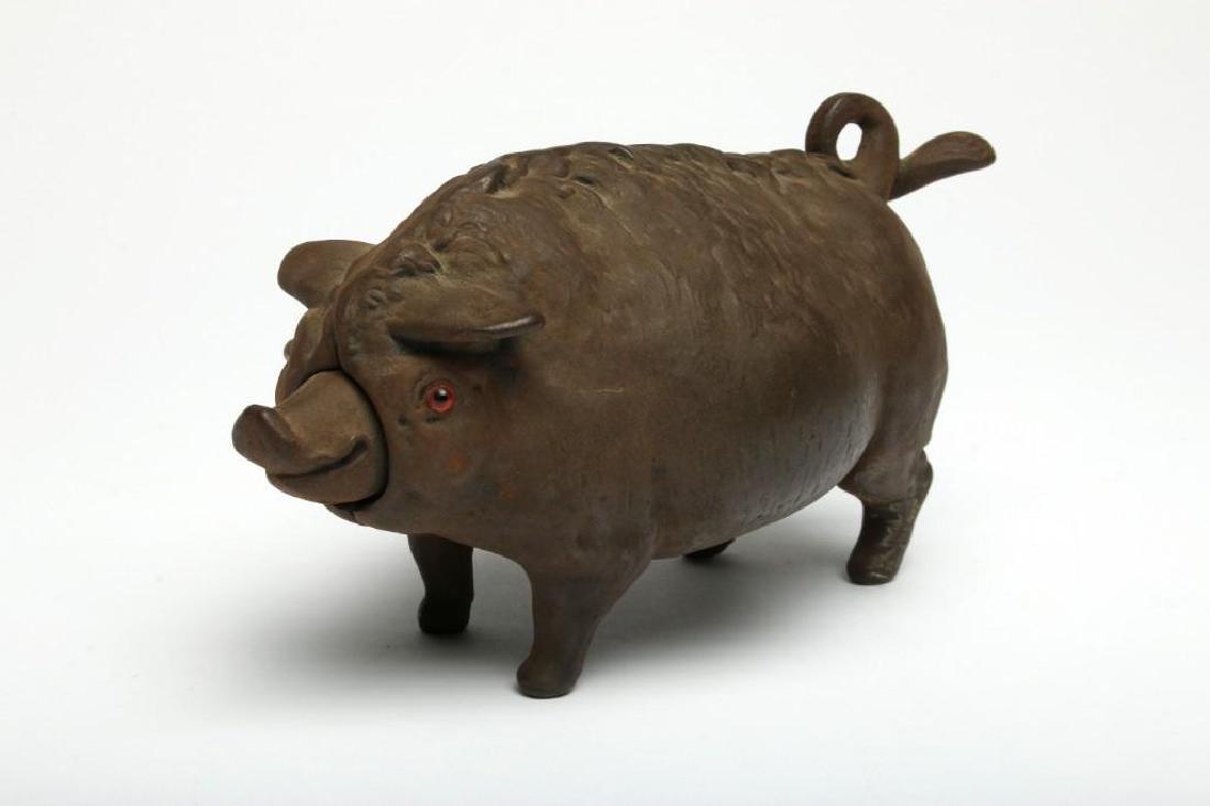 Vintage Iron Winding Bell Pig with Glass Eyes: Cast-Iron Clockwork Figural Pig Butcher Shop Service Bell, glass eyes, Push tail to ring bell. 3.25 in. H x 7.5 in. L x 3.25 in. D