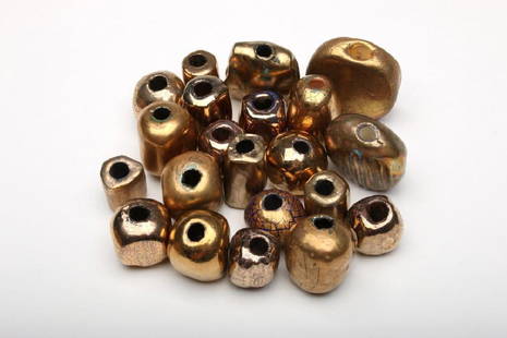 Doyle Lane 24 Gold Art Pottery Beads: Doyle Lane (American, 1925-2002). Approximately .75-1.375 in. H x .625-1.375 in. W x .625-.875 in. D each.