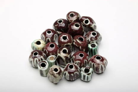 Doyle Lane 20 Brown/Green Art Pottery Beads: Doyle Lane (American, 1925-2002). Approximately .75-1.375 in. H x .5-1.25 in. W x .5-1 in. D each.