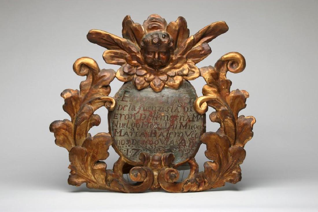 Vintage Cherub Gilded Wood Cartouche Cornice Plaque: Hand painted text on front refers to 1703. 23 in. H x 25.5 in. W x 4.5 in. D.