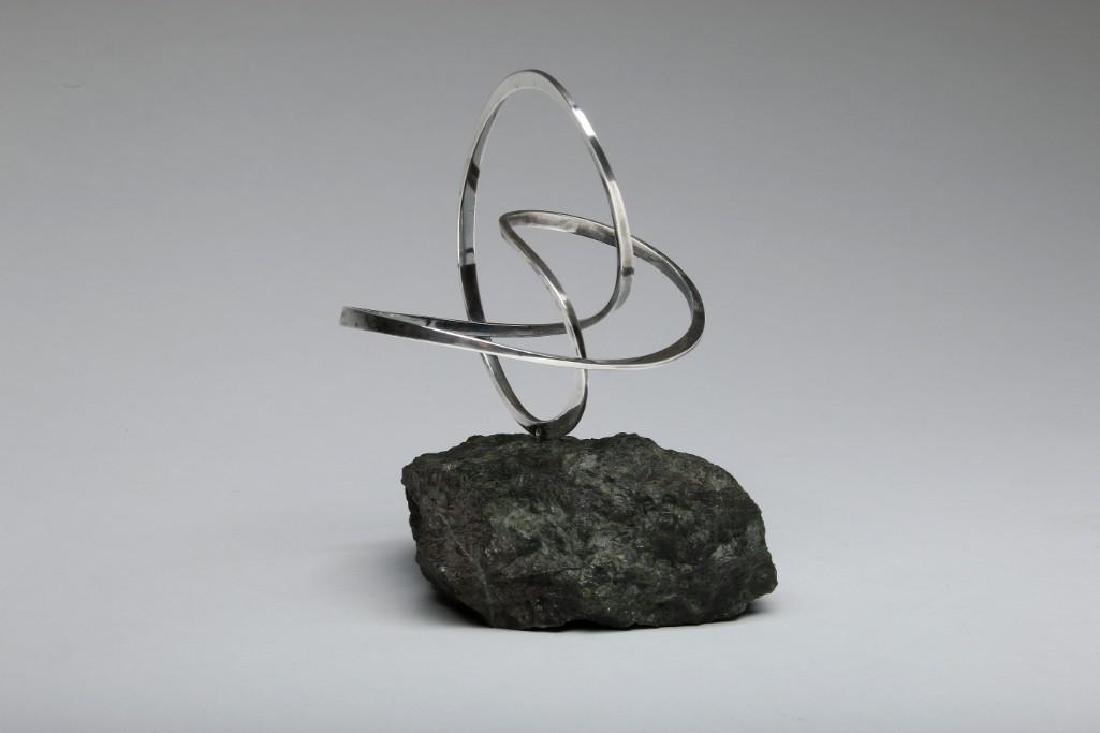 Modern Abstract Silver Sculpture on Rustic Stone Base (1 of 3)