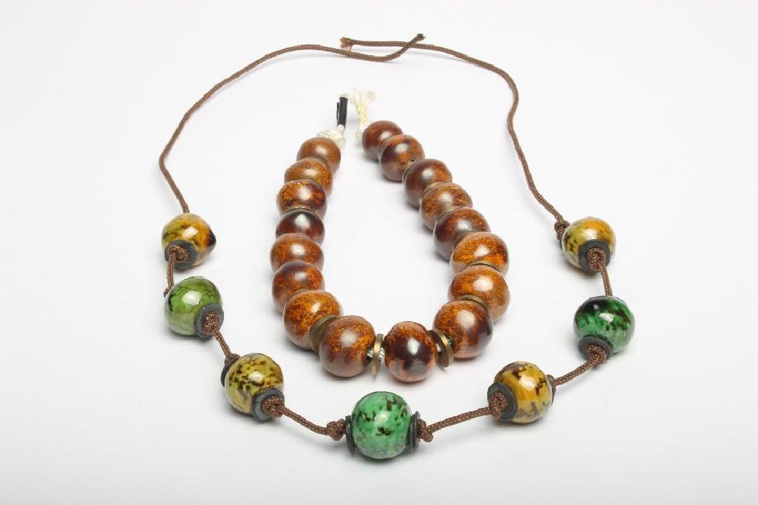 Two Doyle Lane (1925-2002) Ceramic Bead Necklaces: Two original necklace made by Doyle Lane (Calif. (1925-2002). Does not include clasps on necklaces. Approx 20 in. and 17 in long. Multi Bead Necklace designed and constructed by Doyle Lane. Includes r