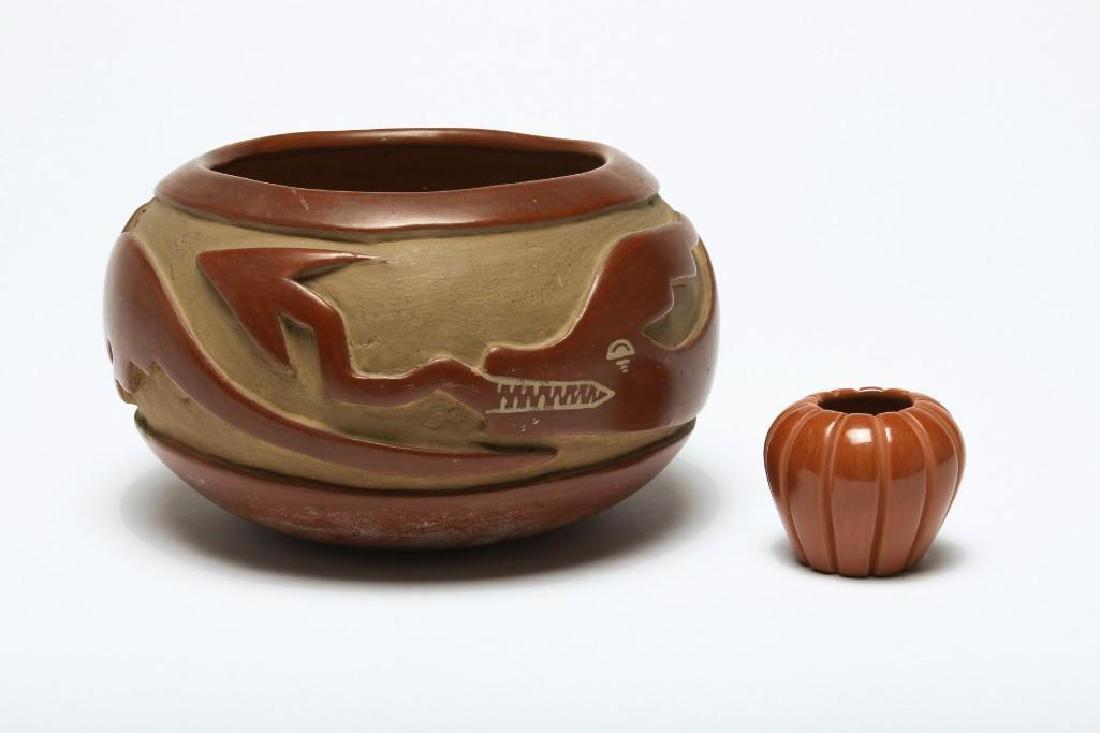 Group of 2 Native American Indian Pots Signed: Signed Naranjo and White Eagle. 1) Red clay deep carved bowl. Avanyu water serpent with spear shaped tongue, signed Madeline (Tafoya) Naranjo, born 1916, Santa Clara. Approx. 7.5 in Dia x 4.5 in H. 2)