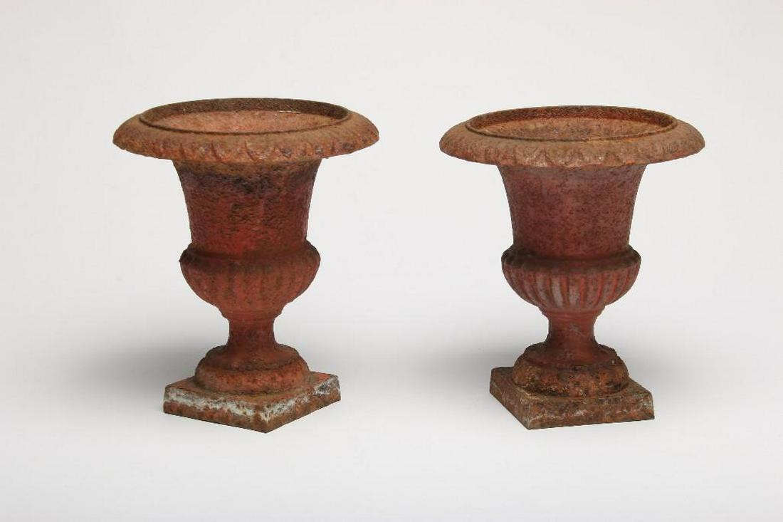 Pair French Cast Iron Garden Urns: Signed R. Remaudiere. Each approx. 10 in H X 9 in Dia. Patinaed red paint and rust.