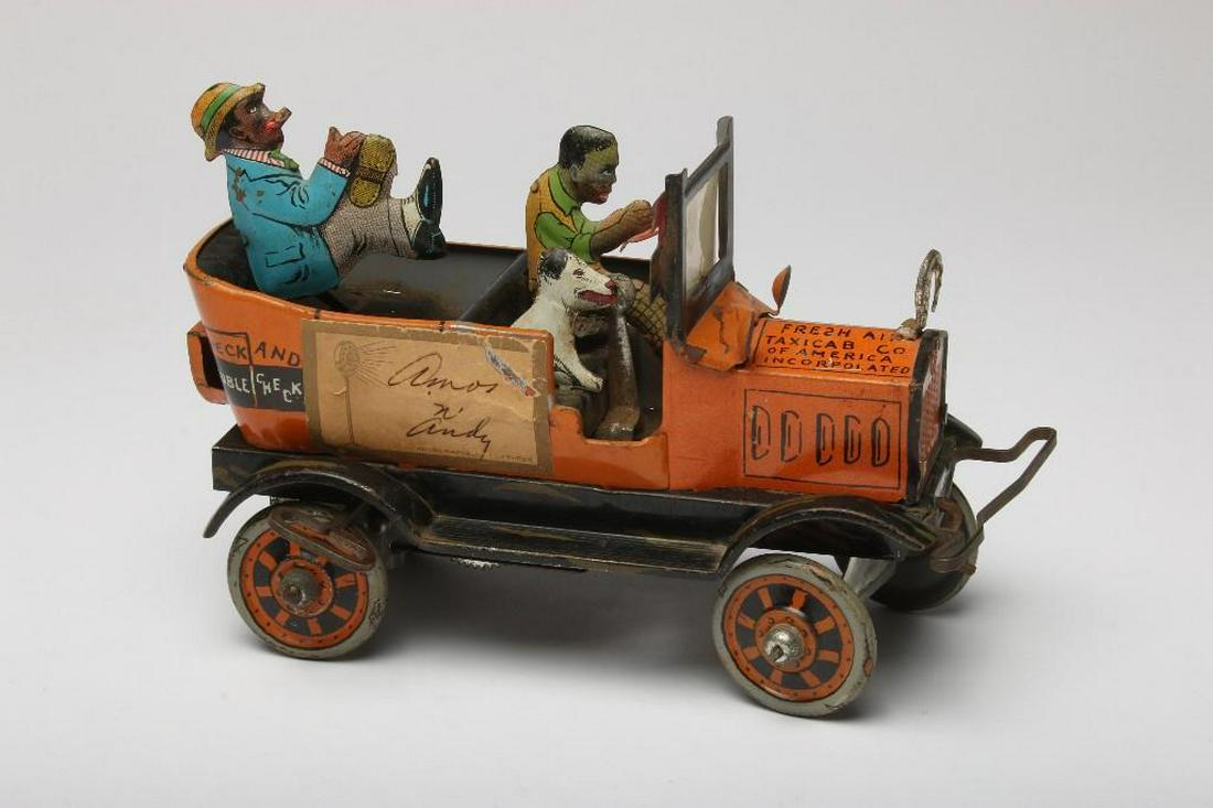 Vintage Louis Marx and Co. Car Signed by Amos 'n' Andy: Vintage Louis Marx and Co. Autographed Features car. Signed by Amos 'n' Andy. Tin lithograph wind up car. Approx. 8 in long.