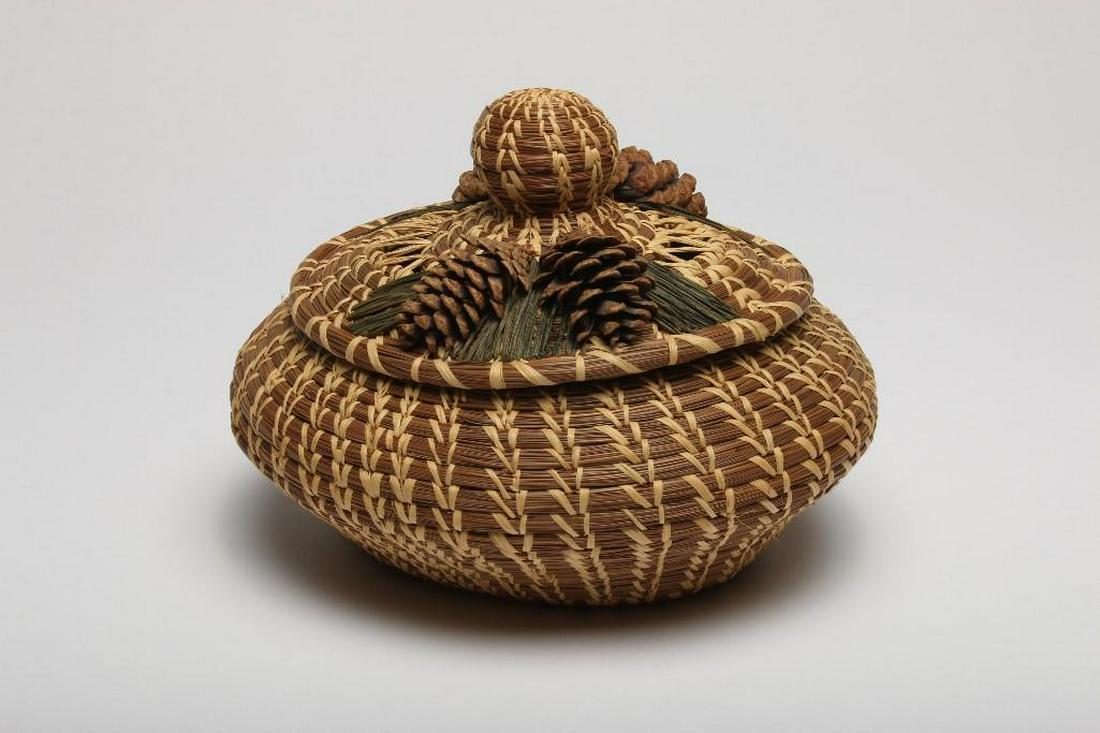 Native American Indian Coushatta Tribe Basket with Lid: Coushatta Tribe from Louisiana, Koasati people. Made with pine needles and rafia. Approx. 8 in H x 10 in W x 9 in D.