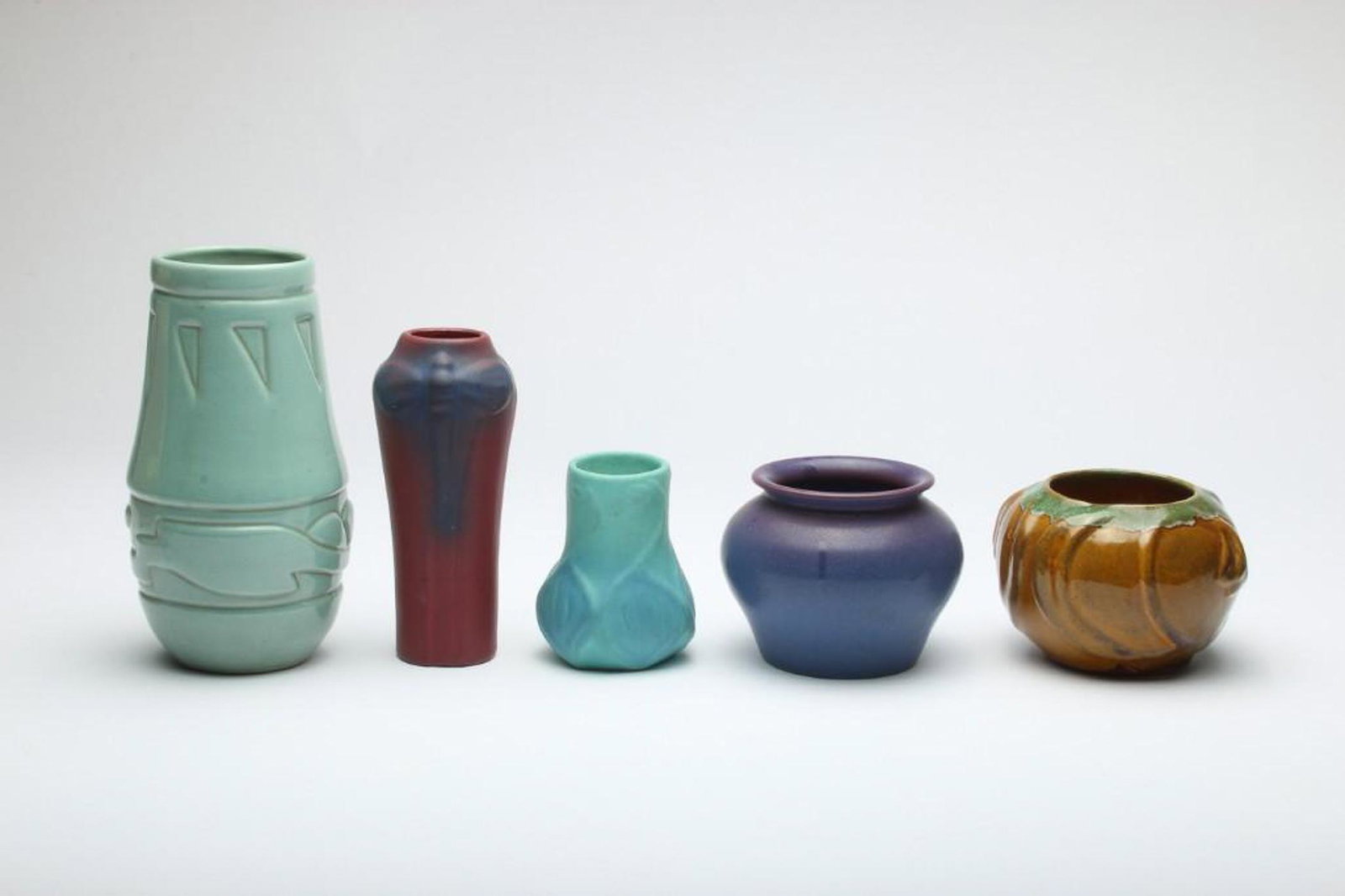 Group of 5 Vintage Anna Van Briggle Vases Art Pottery: Group of five Van Briggle vases and bud vases ranging in size from approx. 4 in H to 8 in H.