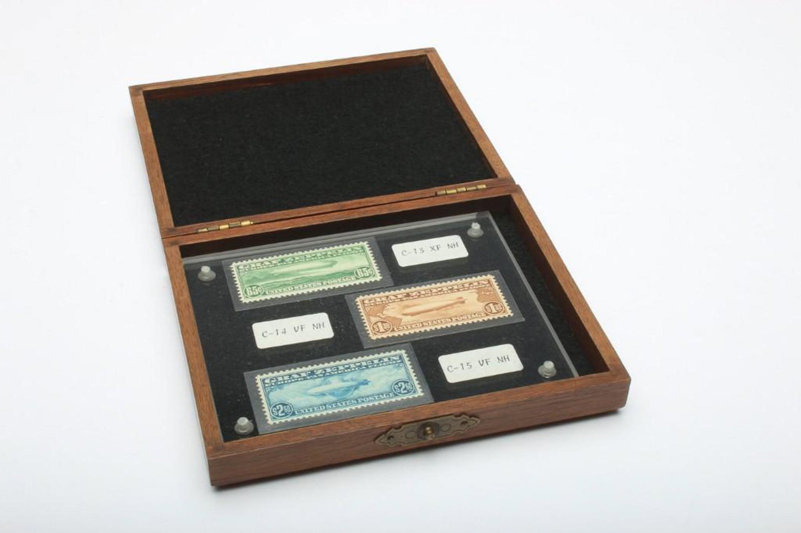 Group of Three 1930 US Graf Zeppelin Pan American Stamp: All three stamps are mint, unused, never hinged. These stamps are Scott Catalog numbers C13, C14, and C15. Comes with presentation box. Box measures 5.25 x 4.25 x 1 in.