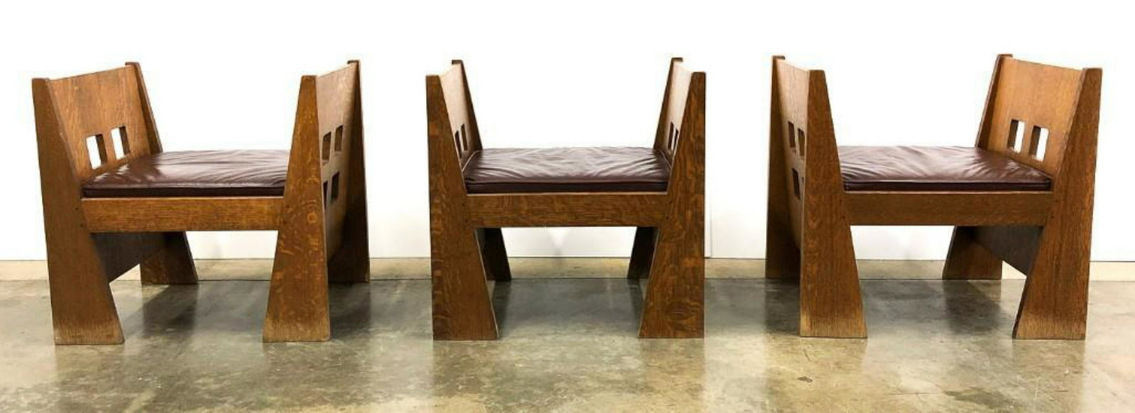 Group of (3) Limbert Arts & Crafts Reproduction Benches: Reproduction Benches (No. 243) Each approx 24.5 in W x 18 in D x 24 in H. Solid oak with brown leather upholstery.