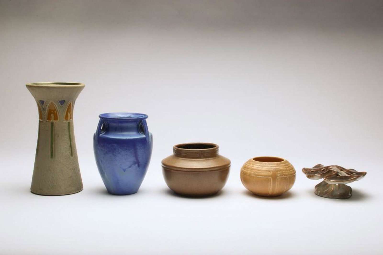 Group of 5 Vintage Roseville Art Pottery Vases Montique: Montique vase approx. 10 in H x 5.5 in Dia at rim; Fulper with handles approx. 7.25 in H x 5.75 in Dia at widest; Vase with lip approx. 4.25 in H x 6.5 in Dia at widest; Tan vase approx. 3.25 in H x 5