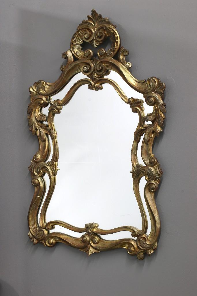 Antique Mirror in Carved Wood Gold Frame: Approx. 42.5 in H x 26.5 in W.