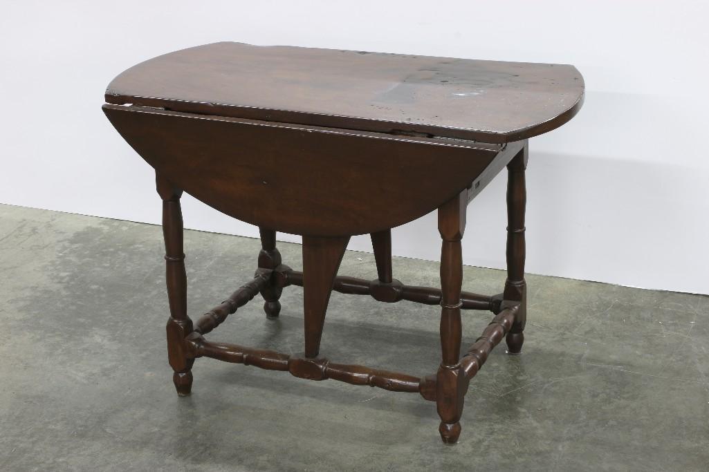 19th Cent Drop Leaf Table Rustic European 2 Drawers: Rustic European drop leaf table with two side drawers. Fully extended table measures approx. 28.25 in H x 41 in Dia. With leaves down table measures 28.25 in H x 41 in W x 24 in D.