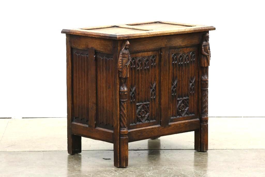Late 1800s Low Chest Gothic Revival Panels: Carved with gothic motif. Top opens to chest. Approx. 24 in H x 24.5 in W x 16 in D.