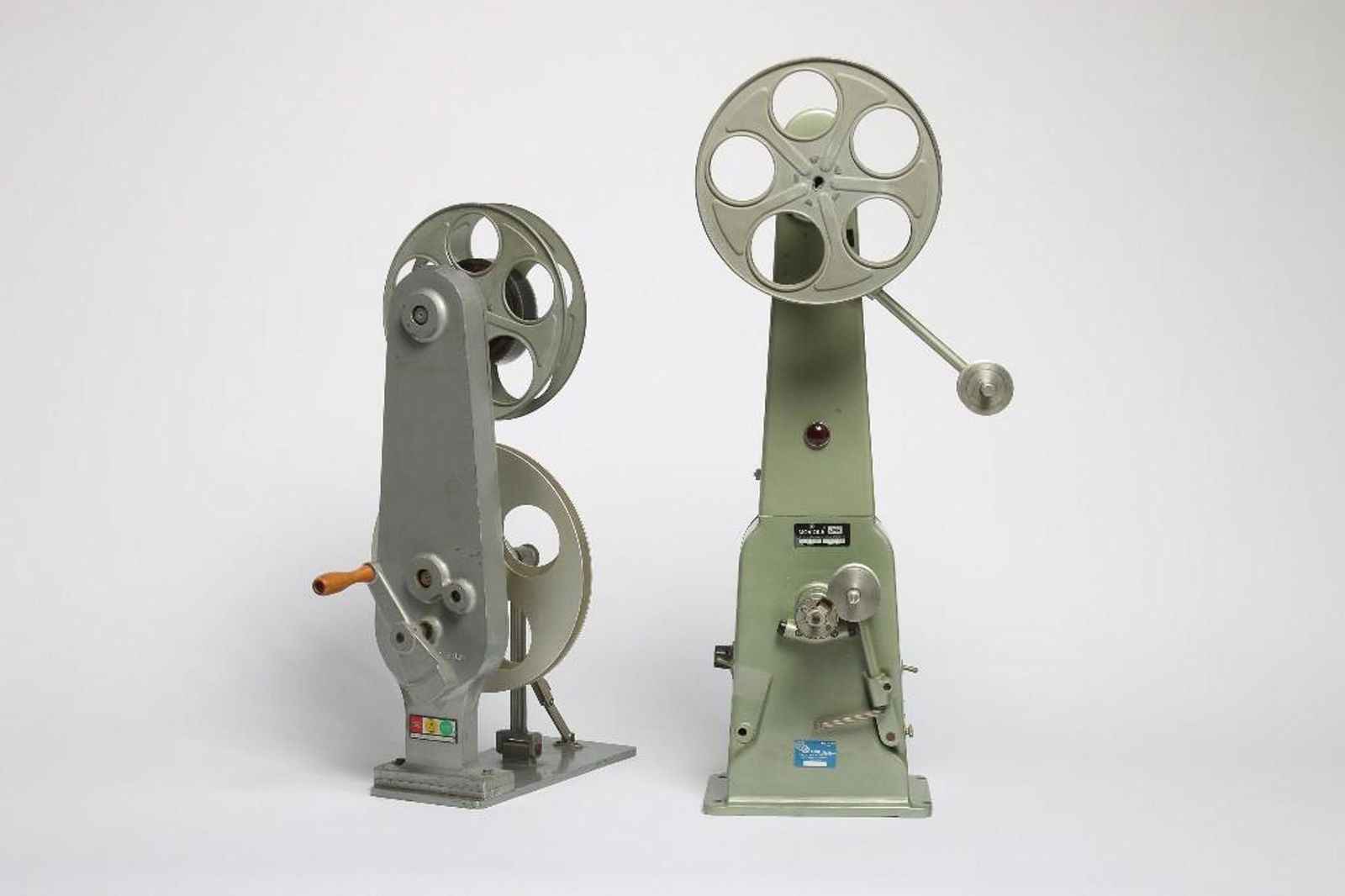 Two Film Rewind Reels & Kiss of the Spider Woman Titles: Approx. dimensions: 32 in H x 6.75 in W x 10 in D. With film from Strand Releasing Kiss of the Spider Woman Titles in 35mm. Provenance: From the Estate of Film Producer and Graphic Artist David Weisma