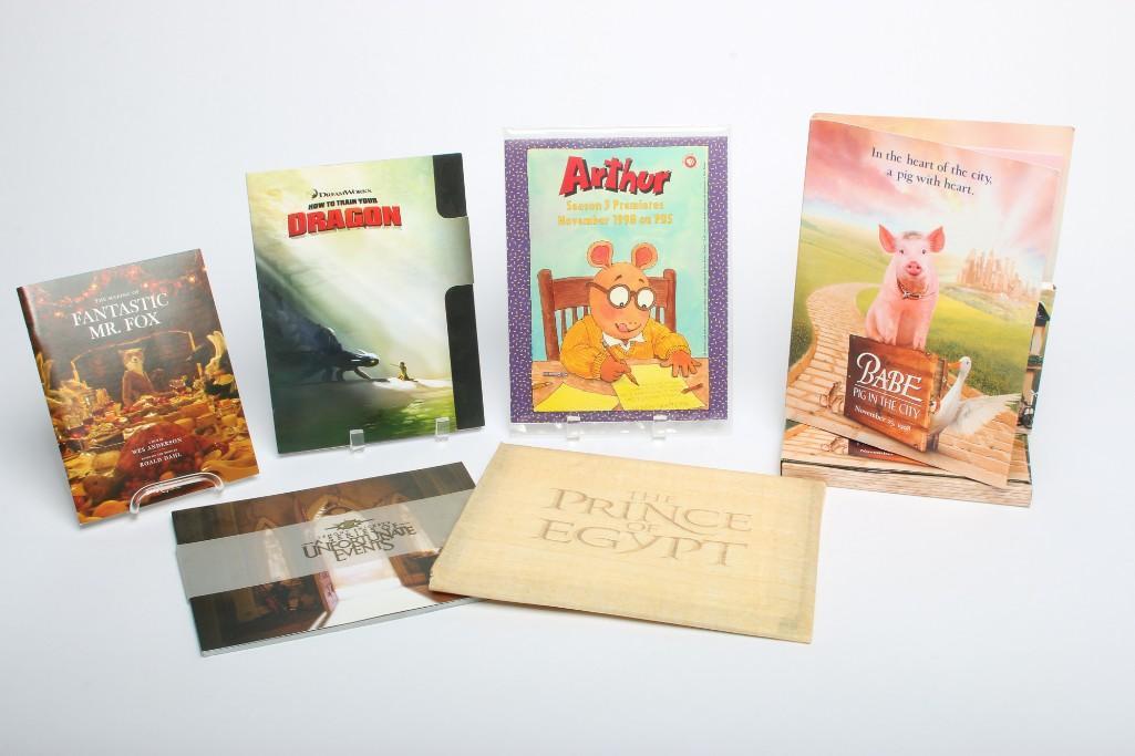 Lot of 15 Family Movie/Television Promotionals: 15 pieces total. Lot includes brochures and promotional materials from productions: Arthur, Babe Pig in the City (x 2 includes sound track CDs and production stills), Fantastic Mr. Fox, How to Train Y