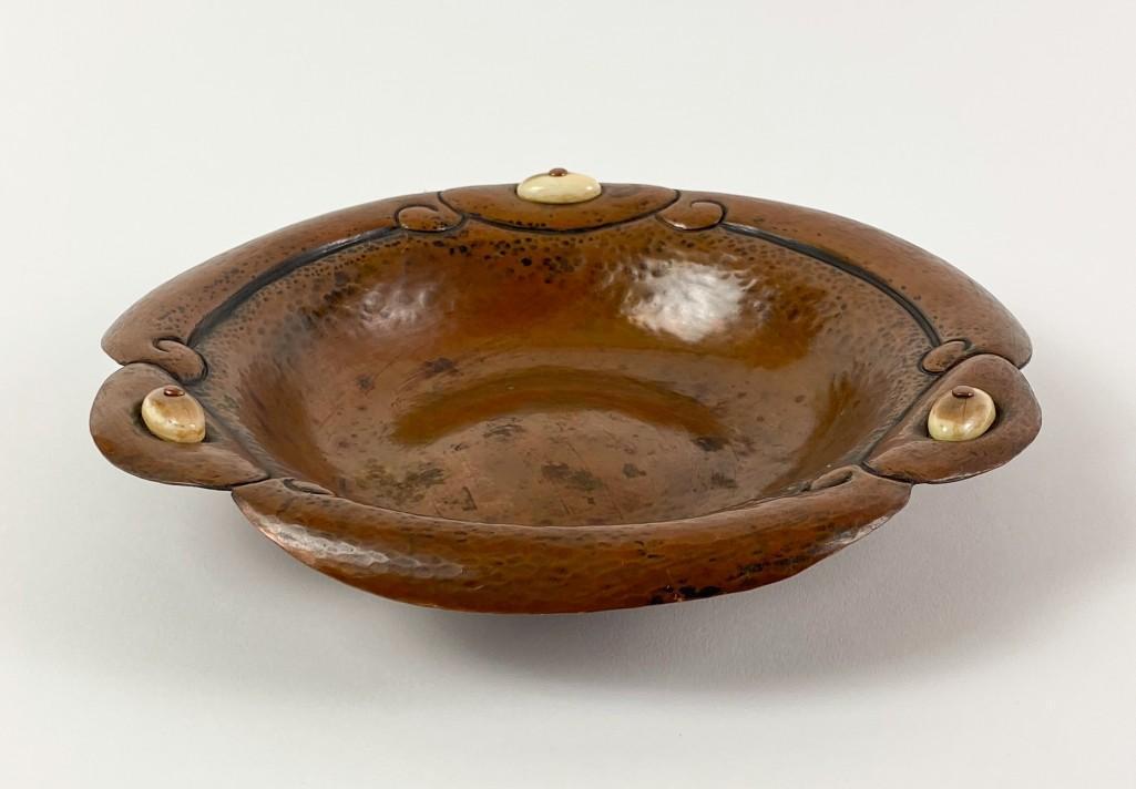 Albert Berry (1878-1949) Hammered Copper Bowl: Hammered Copper Bowl with Fossilized Whale Bone. Approx dimensions: 9.5 in W x 1.75 in H. Weight: 12 oz