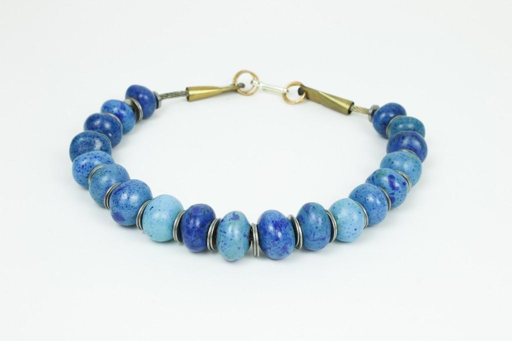 Doyle Lane (1925-2002) Ceramic Blue Bead Necklace: Original Doyle Lane (1925-2002) Ceramic Blue Bead Pottery Necklace. Constructed by Doyle Lane with two washers between each bead. 19 beads. Approx. 21.5 inches long. Weight: 218.5 grams.