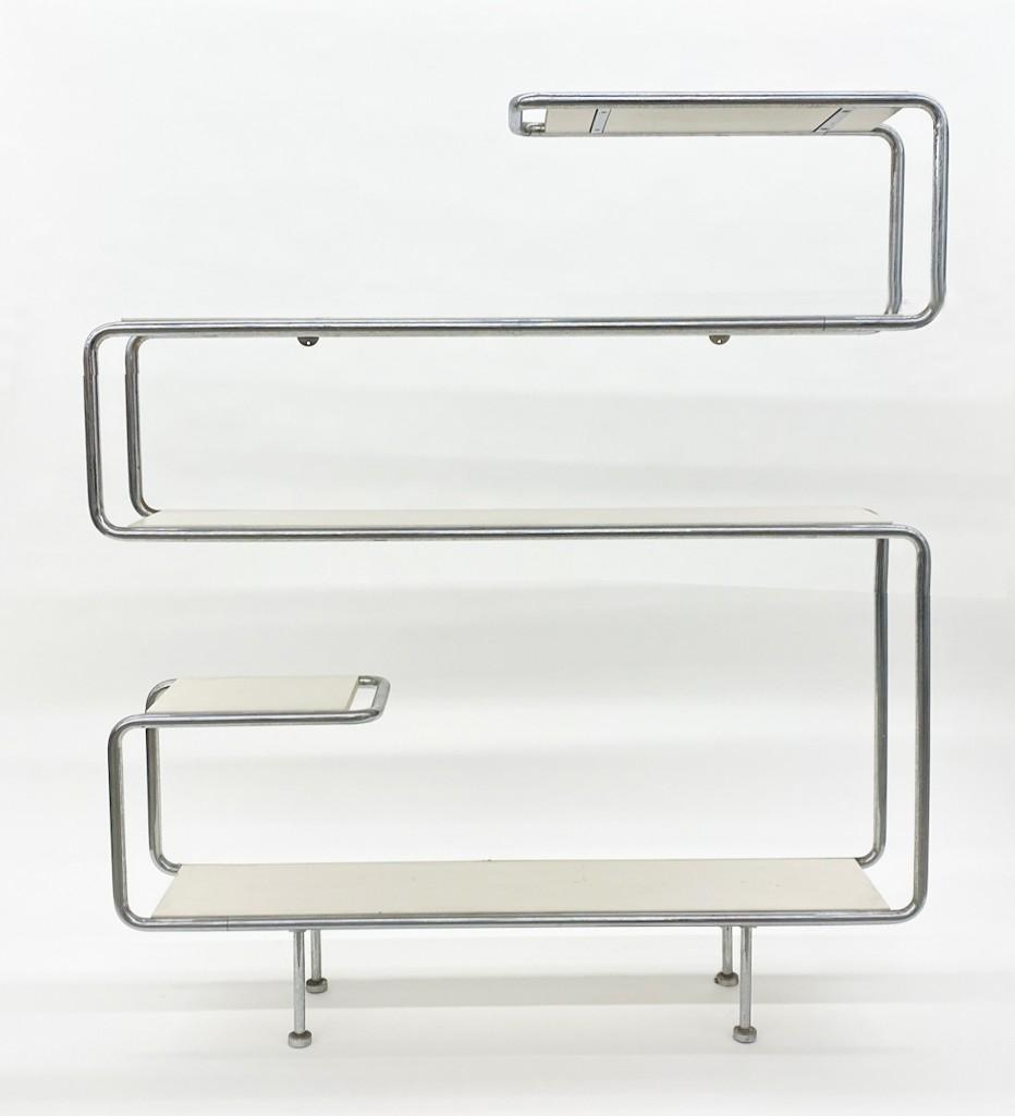 Tubular Chrome White Shelving Wall Unit: Approx. 66 in H x 57 W x 12 Deep. Needs to be attached to wall to be level.