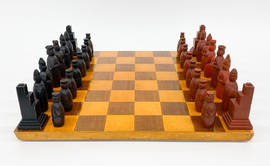 Vintage Carved Wooden Chess Set: Vintage Carved Wooden Chess Set. Pieces vary from 3 in. to 4.5 in. Board approx. 20 in. x 20 in. Weight 9 lbs 13 oz.