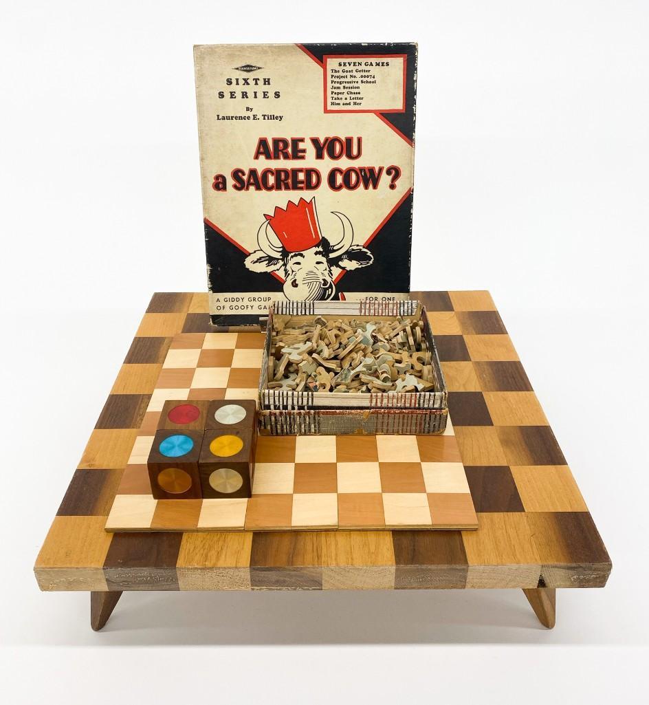 Group of Vintage Puzzles, Games, Game Boards Chess: Includes "Are you a Sacred Cow", Plywood Jigsaw Puzzle, Multicolored Cubes, and (2) Chess/Checker Boards. Approx. 16 in. x 16 in. x 7 in. Weight 8 lbs.
