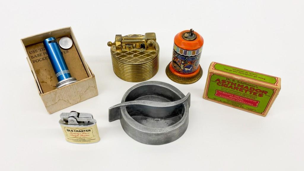 Group of Vintage Cigarette Lighters Cigarettes Ashtray: Group of Vintage Cigarette Lighters, Cigarettes, and Ashtray. Six (6) pieces total. Includes everything shown. Weight 2 lbs. 4 oz.