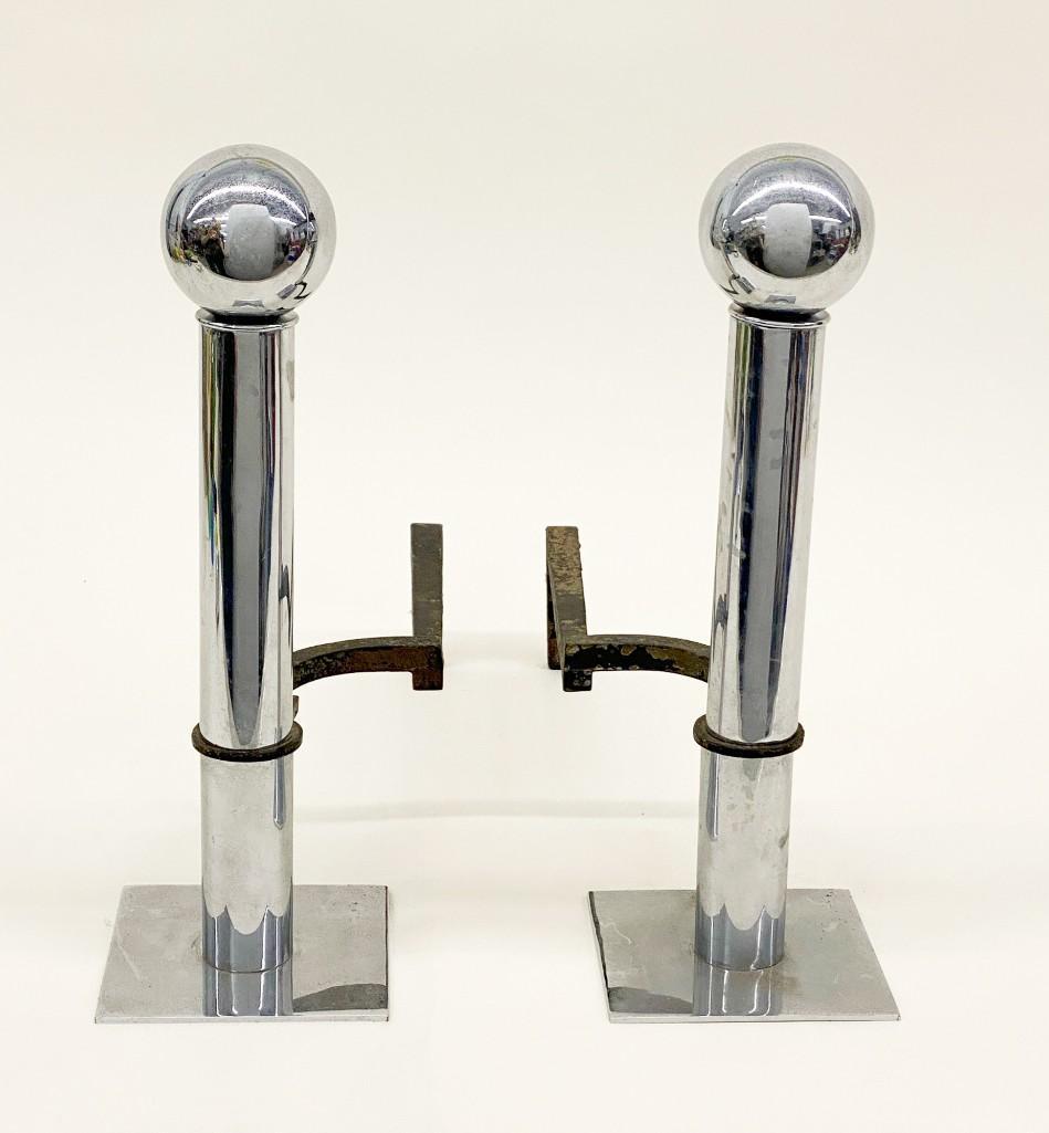 Pair Art Deco Chrome Fireplace Andirons: Pair Art Deco Chrome Andirons. Approx. 15 in. H x 17 in. D. Weight 9 lbs.