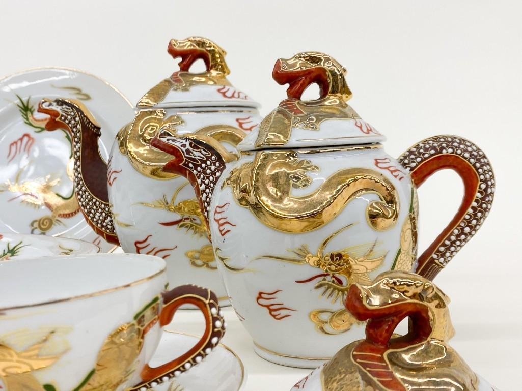 Asian Golden Dragon Porcelain Lithophane Tea Set: Vintage Porcelain Tea Set with Lithophane cups. Nineteen (19) pieces including one extra lid. Weight 7 lbs.