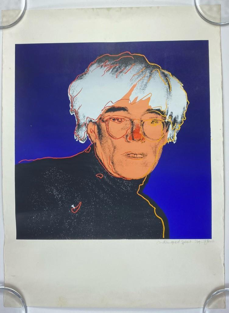 Artist Unknown Portrait of Andy Warhol Signed Print: Portrait of Andy Warhol done in his style. Artist's signature illegible. Titled, "Endangered Specie" (sic). "Specie" without the last "s" means "money". Perhaps the artist did mean to use that word. A