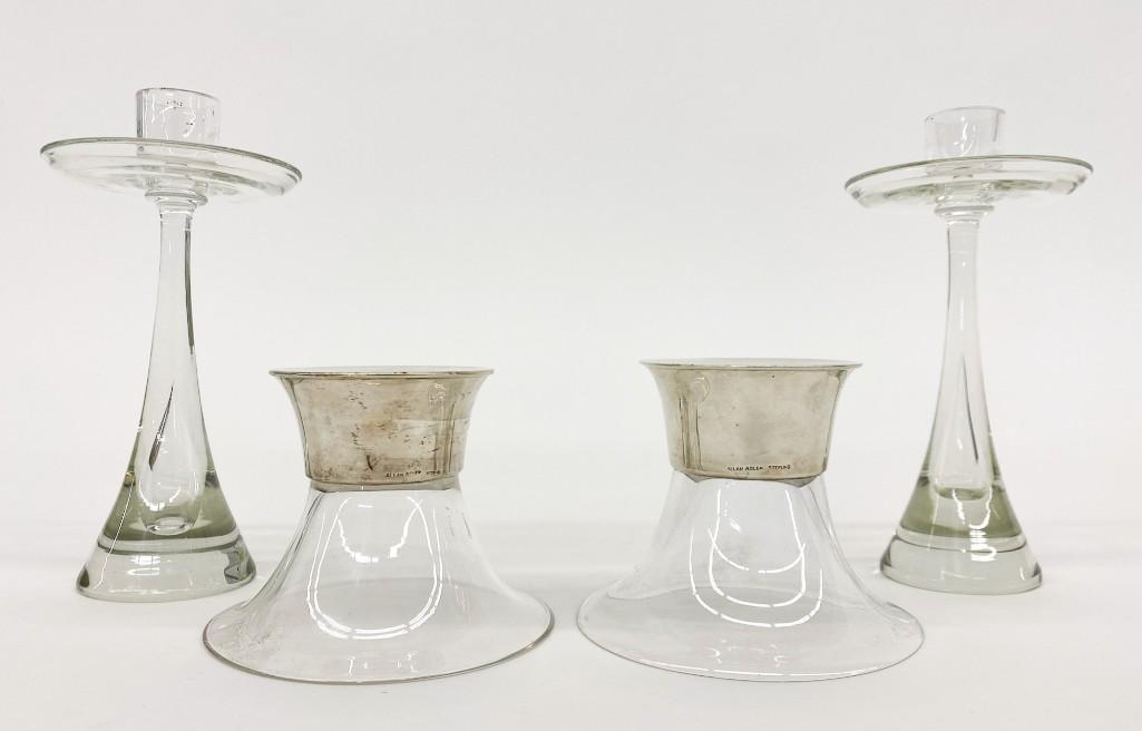 Two (2) Pairs MCM Sterling Candle Holders Allan Adler: Two (2) Pairs Vintage Mid-Century. Glass/Sterling Candle Holders. Allan Adler pair measure approx. 4.5 in. x 3.5 in. Unmarked Glass Pair measure approx. 7.25 in. x 3.5 in. Weight 2 lbs. 11 oz.