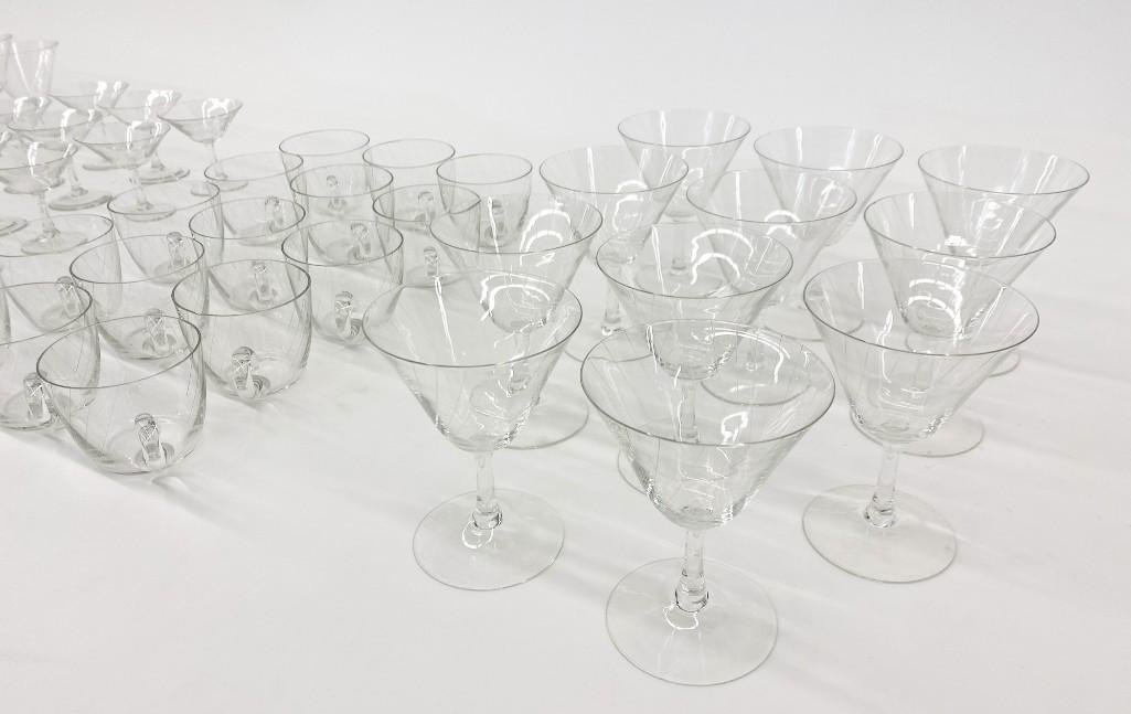 52 Piece Set Vintage Glassware Engraved Line Pattern: Set of Vintage Glassware with Engraved Line Pattern. Diagonal engraved lines make a fascinating visual effect. 52 Pieces. (15) Punch cups 2.5 in. (15) Cordials 3.25 in. (11) Wine glasses 4.5 in. (11) 