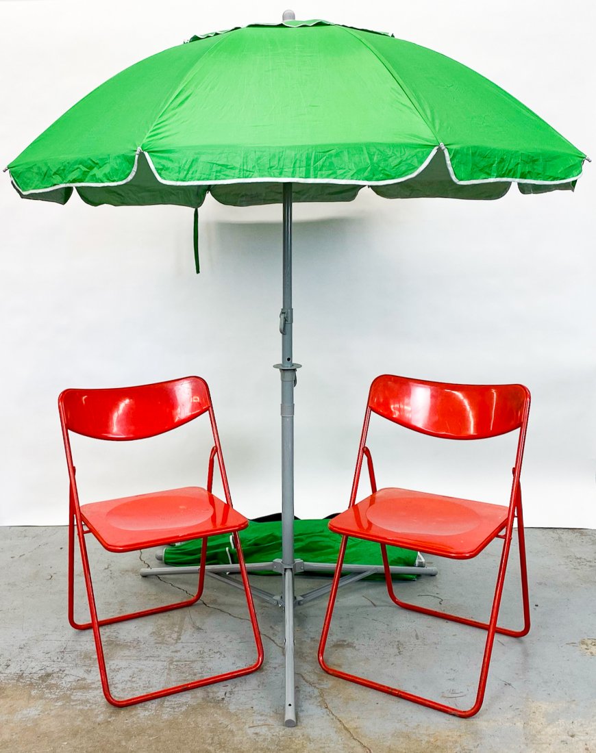 Pair Damama's Vintage IKEA Chairs and Umbrellas: These are the Damama's personal chairs and umbrellas that were used at outdoor markets on both coasts. Approx dimensions: Chairs: 30 in H Umbrella: 63 in Dia.