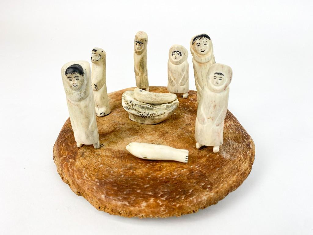 Victor Tocktoo (b.1925) Inuit Carved Diorama: Victor Tocktoo (b.1925) Inuit Carved Bone / Antler Figures Diorama. Features 9 Depictions of People/Animals. Overall very good condition. Approx dimensions Figures Ranges from 1 in. H to 3.5 in. W. Ba