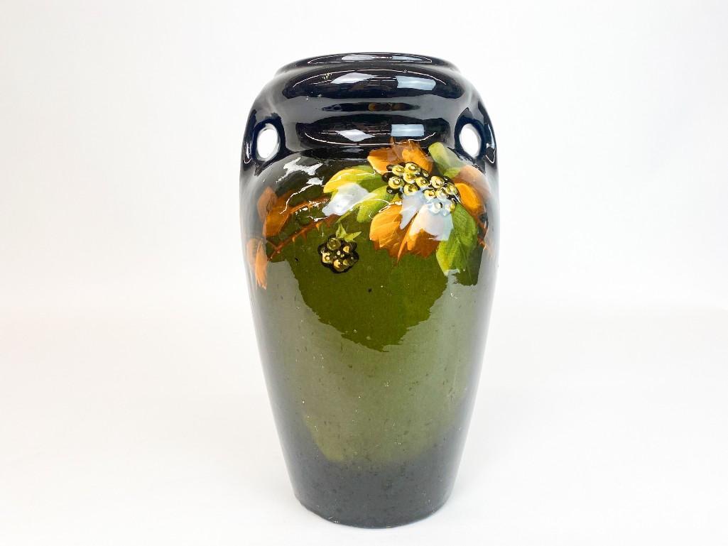 McCoy Pottery Early Urn w/ Floral Design: Stamped "02" on bottom. Several small chips present. Approx. dimensions: 12.5 in. H x 7.5 in Dia. Weight: 6 lbs. 9 oz.