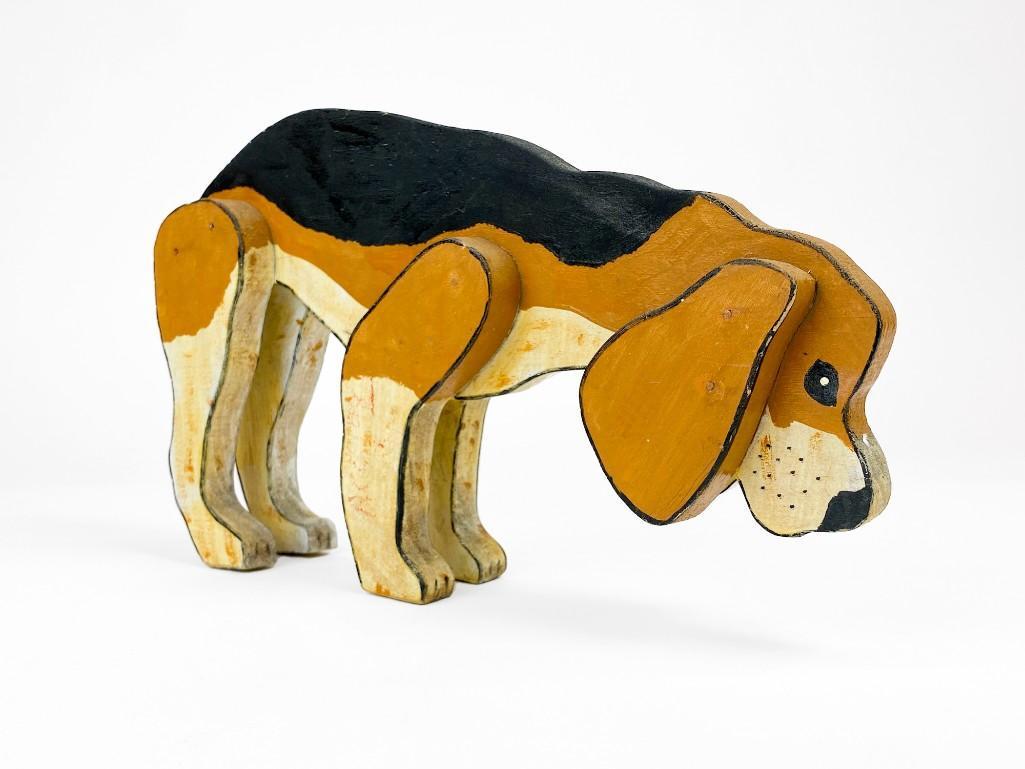 Vintage Wooden Painted Beagle Figure: Vintage Wooden Painted Beagle Figure. Some surface wear and damage on tail. Approx. dimensions: 8.5 in. H x 14.5 in. W x 2 in. D. Weight: 1.3 lbs.