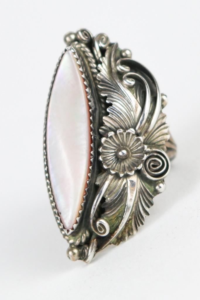 Wilford Chee Navajo Ring Leaf Motif Silver Mother of Pearl: Wilford Chee Navajo Ring Leaf Motif Silver Mother of Pearl. Ring face is approx. 1.5 in x 1 in. Stamped WC and Sterling. Ring size 8. Weight 11.6 grams.