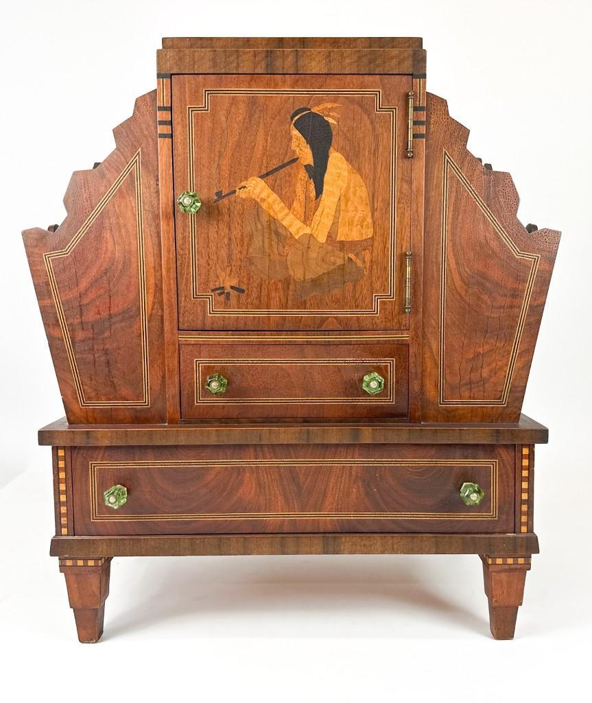Inlay Wood Cabinet w/ Smoking Indian Design Made by Los Angeles Craftsman: Inlay Wood Cabinet w/ Smoking Indian Design Made by Los Angeles Craftsman. Smoking cabinet chess board with door, 2 drawers and magazine pockets. Approx. 25.75 x 22.625 x 13.125 in. Weight 29.55 lbs.