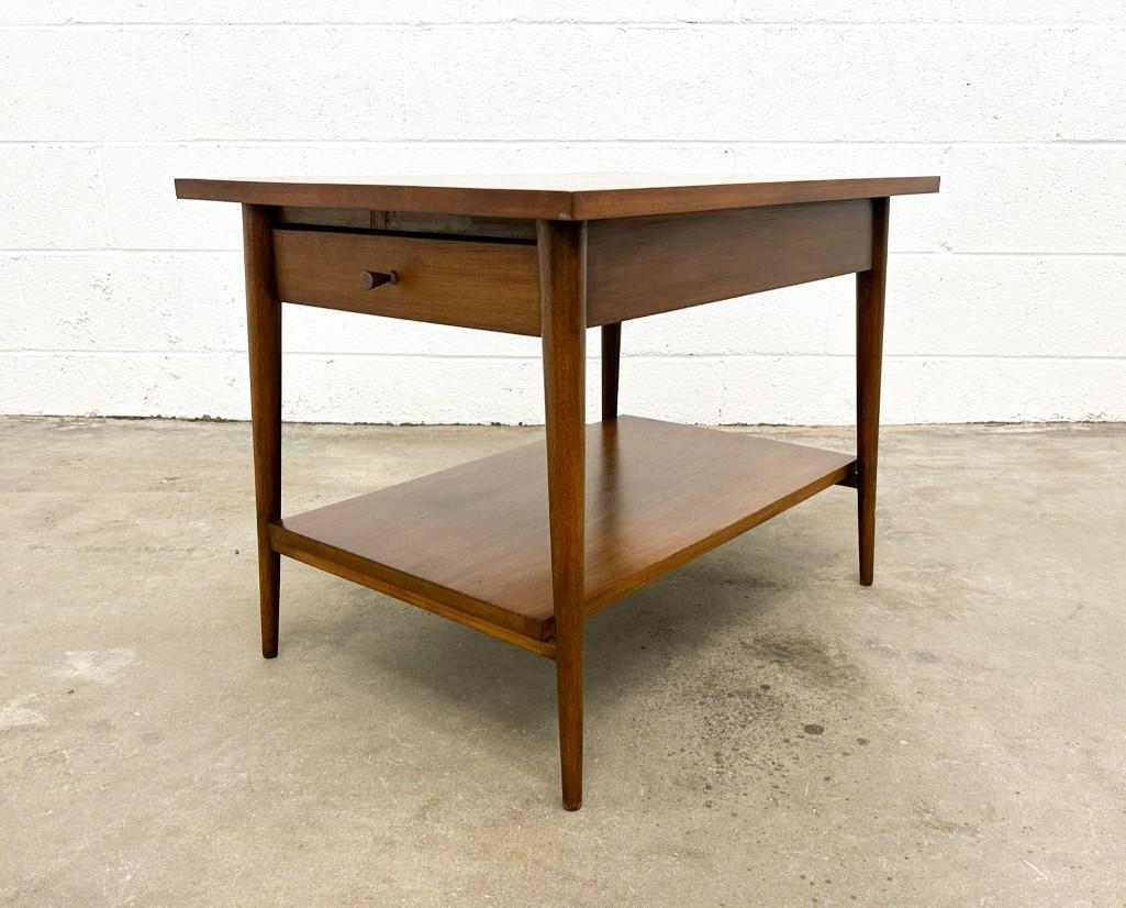 Paul McCobb Planner Group End Table: Paul McCobb Planner Group End Table. Paul McCobbend table. One drawer. Crayon marks in drawer bottom. Walnut. Approx. 20 in. H x 19.25 in. x 26.5 in. D.