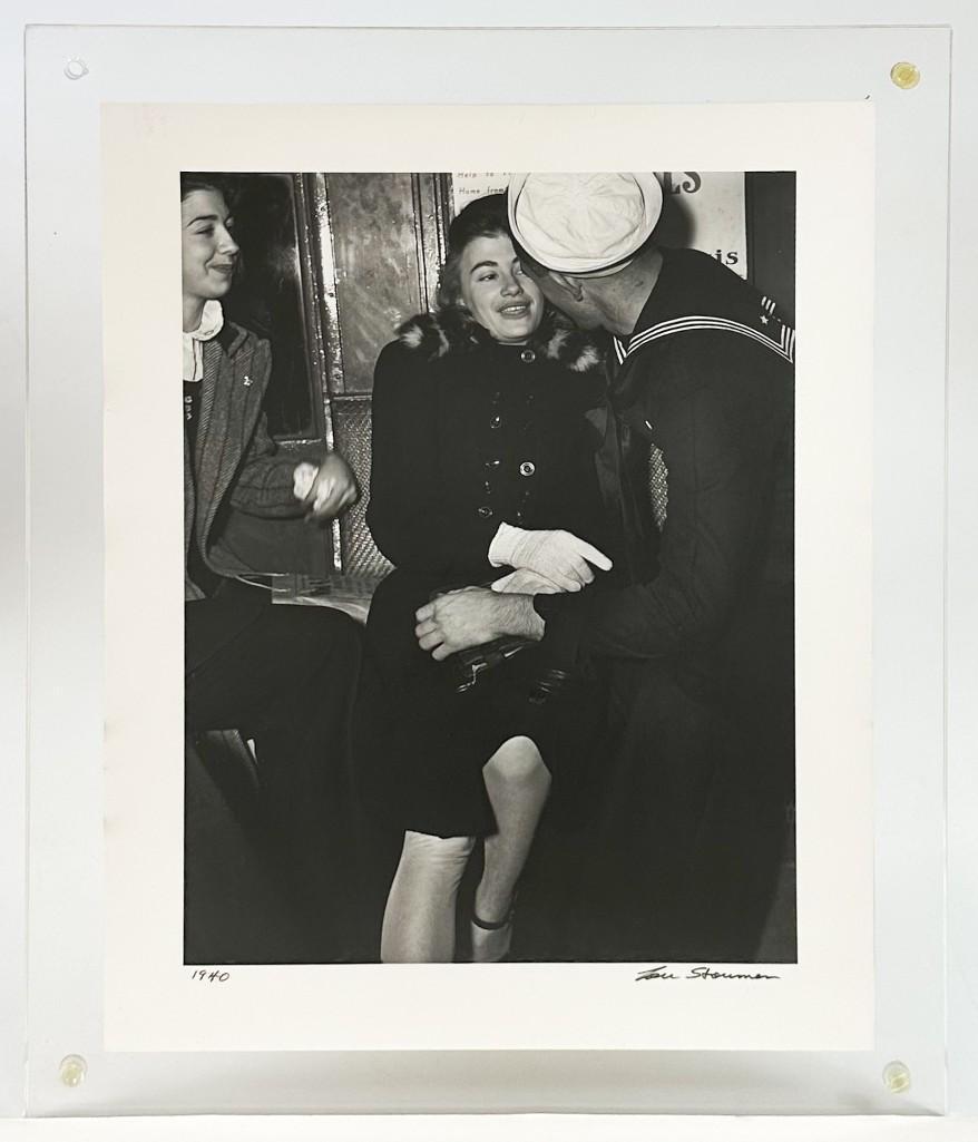 Lou Stoumen (1917-1991) Sailor And Girl On Subway: Lou Stoumen (1917-1991) Sailor And Girl On Subway. In acrylic frame. Good condition. Photo paper 14 x 11 in. Image size 11.75 x 9 in. Weight 2.3 lbs.