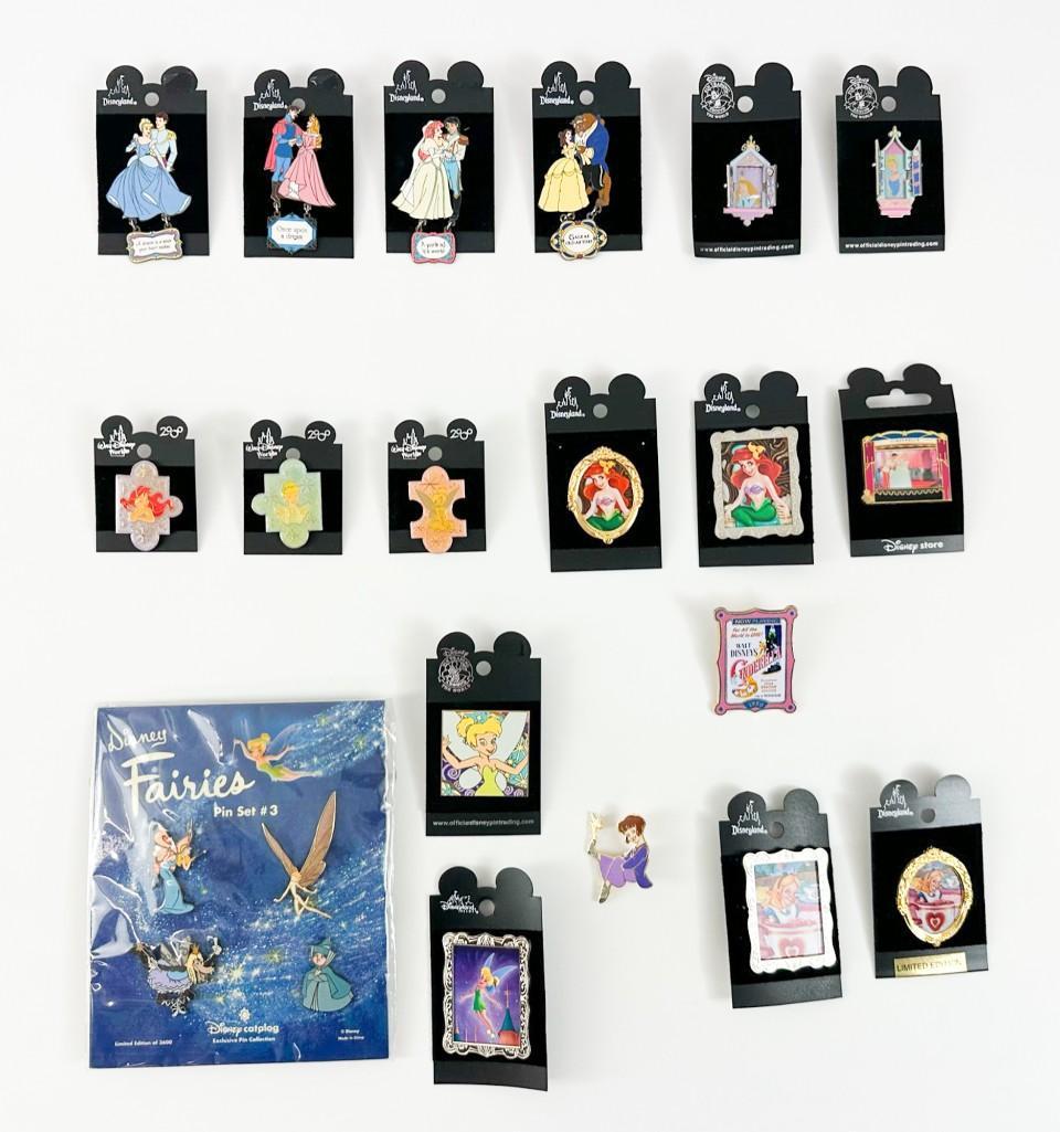 Lot of 19 Disney Enamel Pins Cinderella Belle Aurora Ariel Tinkerbelle Alice: Lot of 19 Disney enamel pins including Cinderella, Belle, Aurora, Ariel, Tinkerbelle and Alice. Weight .7 lb.